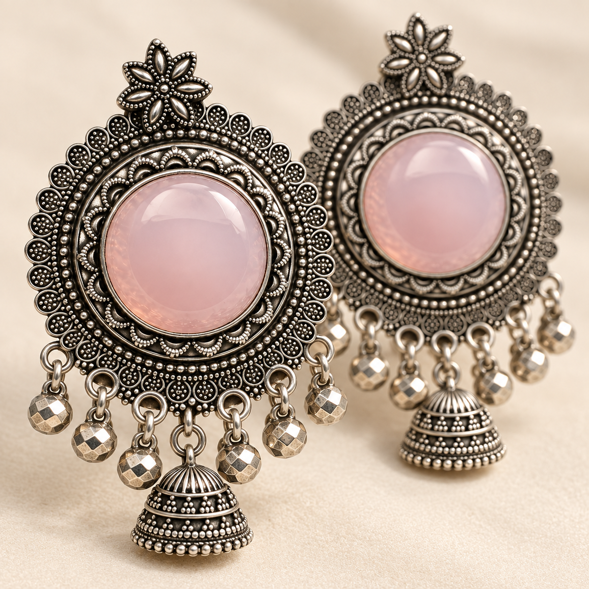 Pink floral jhumka earrings closeup