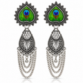 Peacock motif oxidised silver earrings on white background