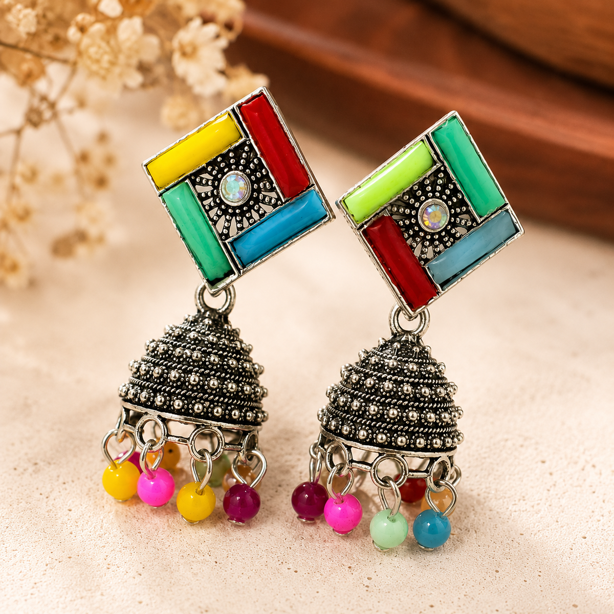 Detailed close-up of multicolor jhumka earrings