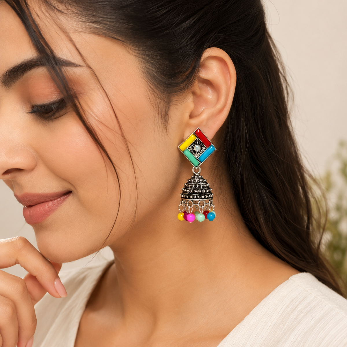Model wearing multicolor oxidised jhumka earring