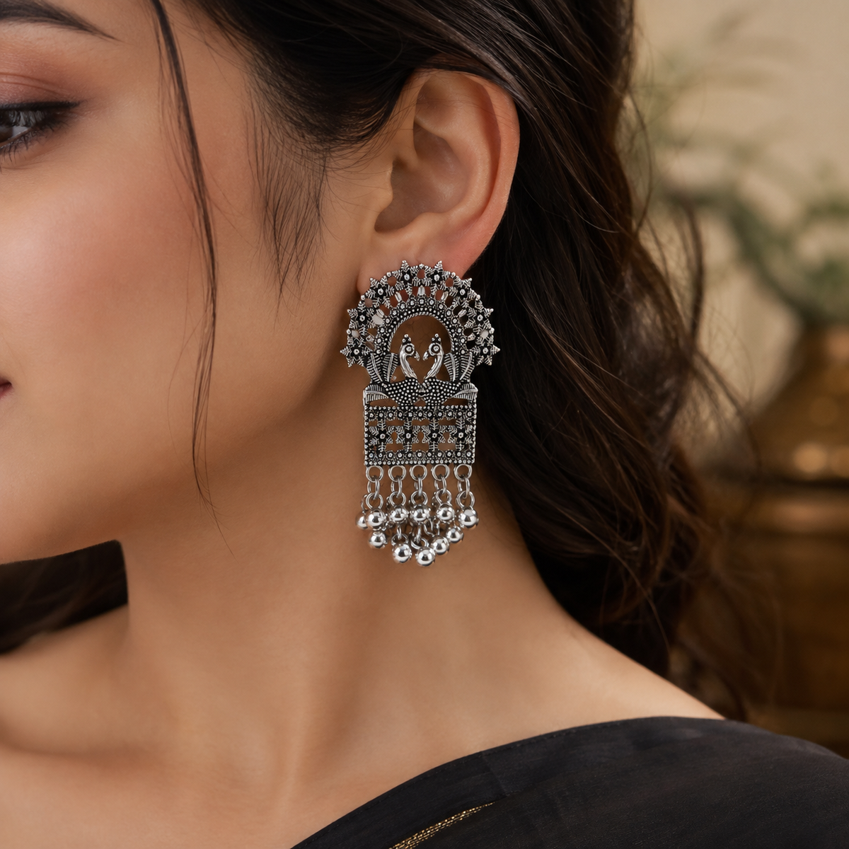 Model wearing oxidised peacock earrings JH-70