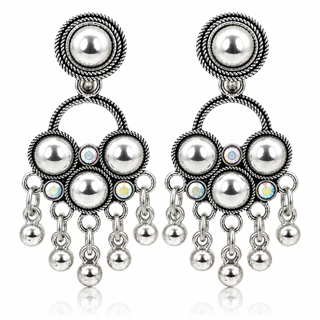 Pair of oxidised silver chandbali earrings on white background