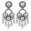 Pair of oxidised silver chandbali earrings on white background