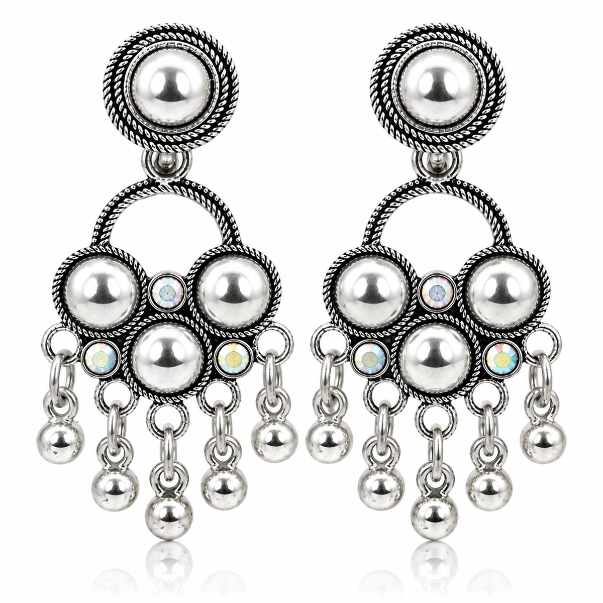 Pair of oxidised silver chandbali earrings on white background