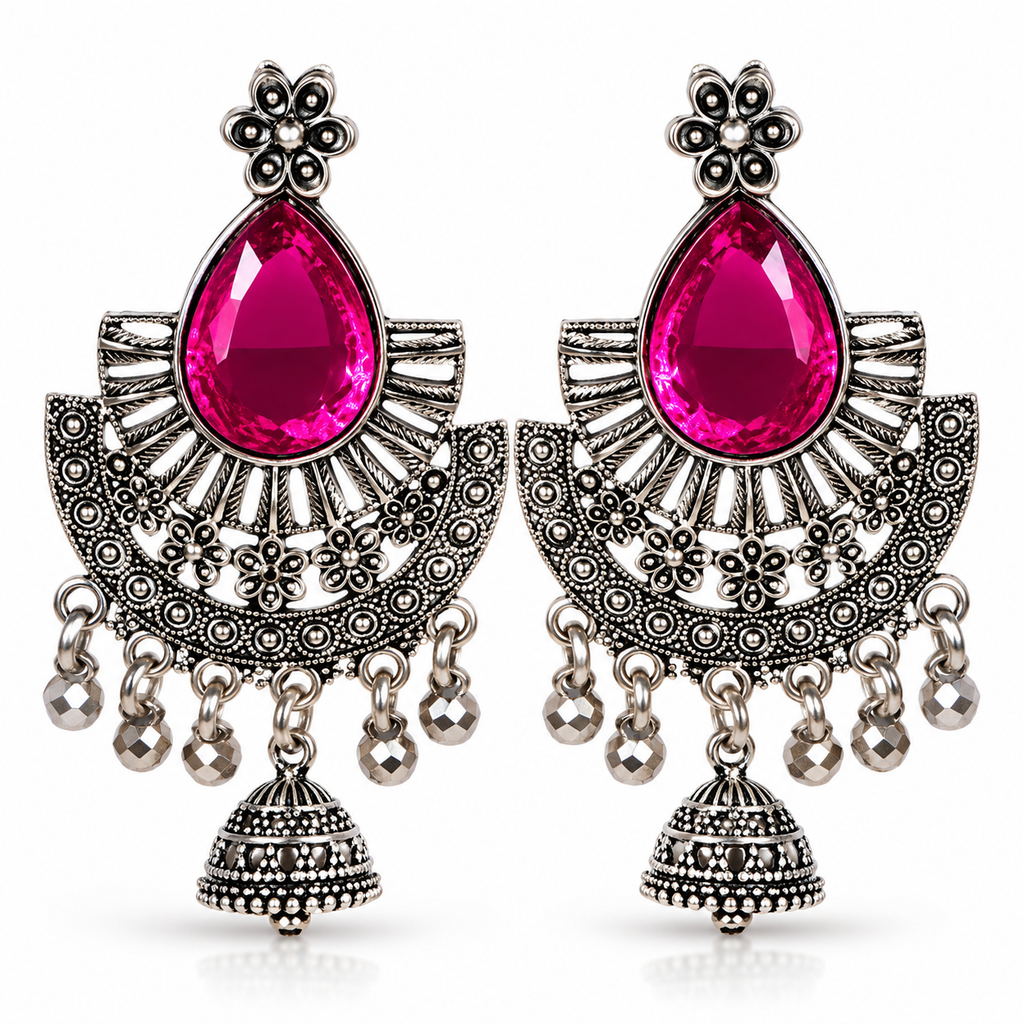 Oxidised silver tone pink stone chandbali jhumka earrings on white background