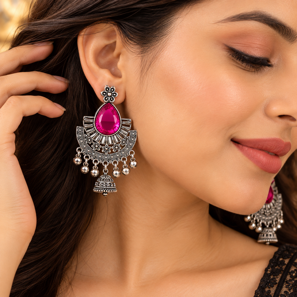 Model wearing pink stone chandbali jhumka earrings