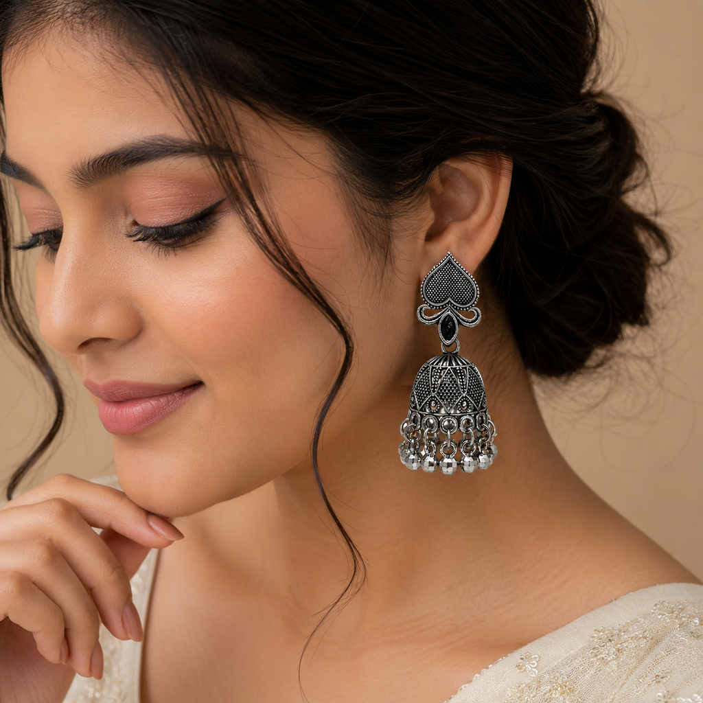 Model wearing JH-65 oxidised silver jhumka earring