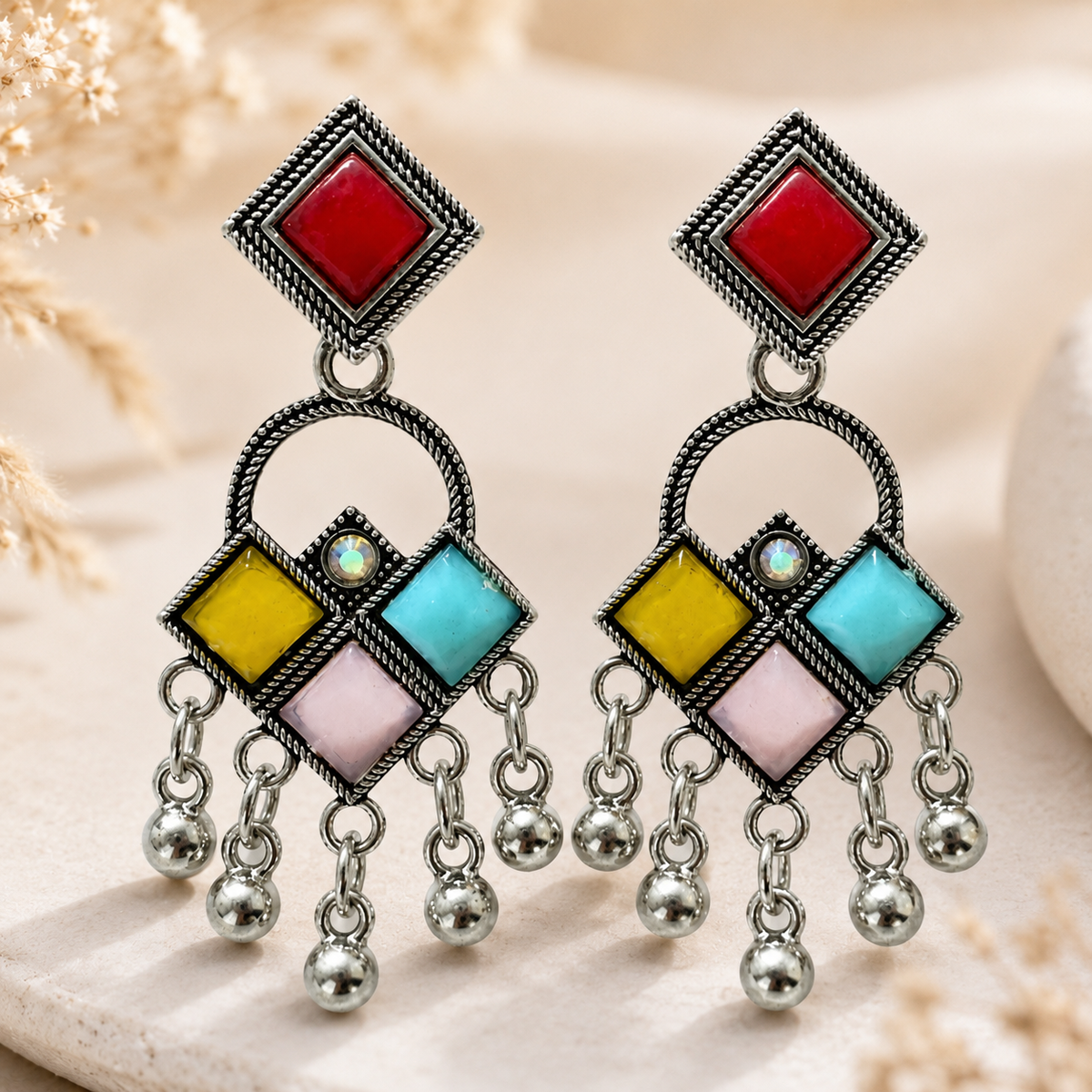 Close-up view of multicolor geometric oxidised earrings