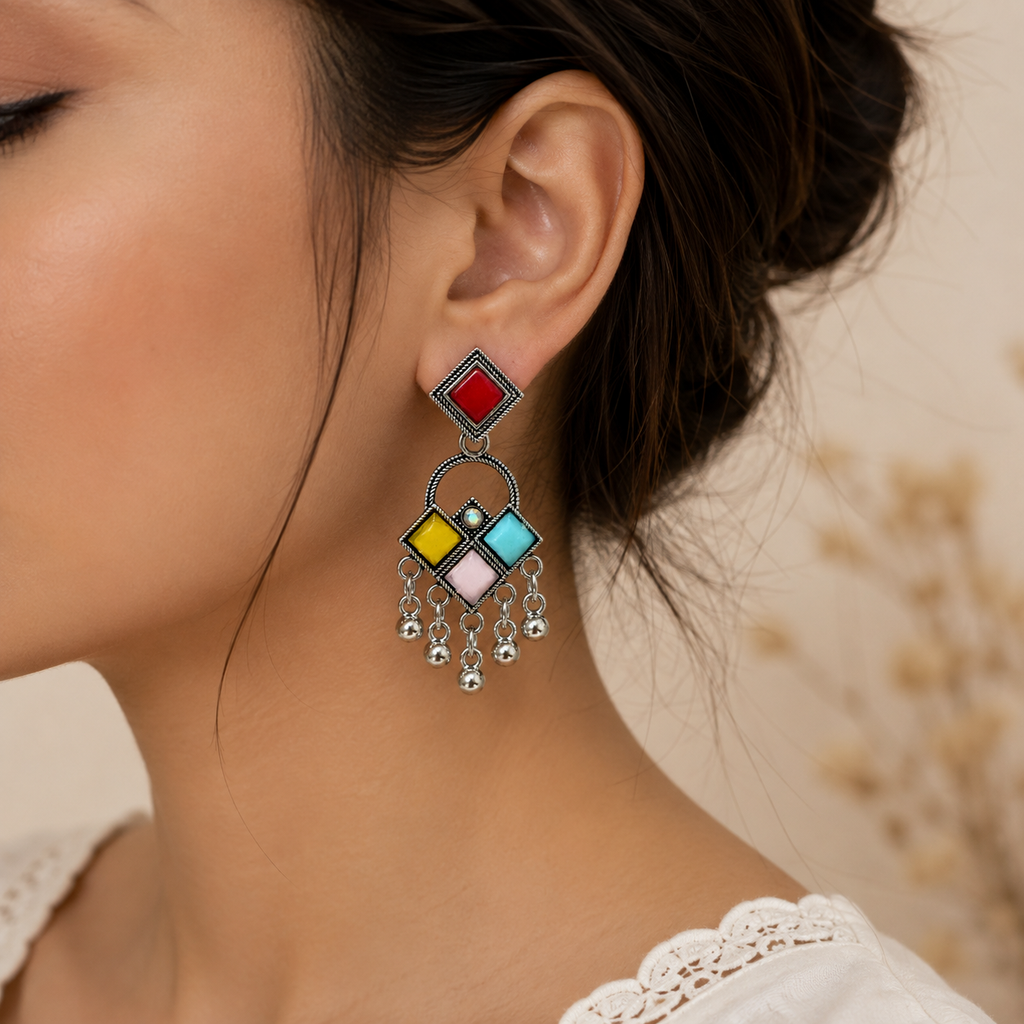 Model wearing multicolor oxidised geometric dangler earring