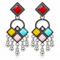 Pair of multicolor oxidised geometric dangler earrings on white background