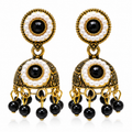 Black stone and pearl-style antique-gold jhumka earrings against white background